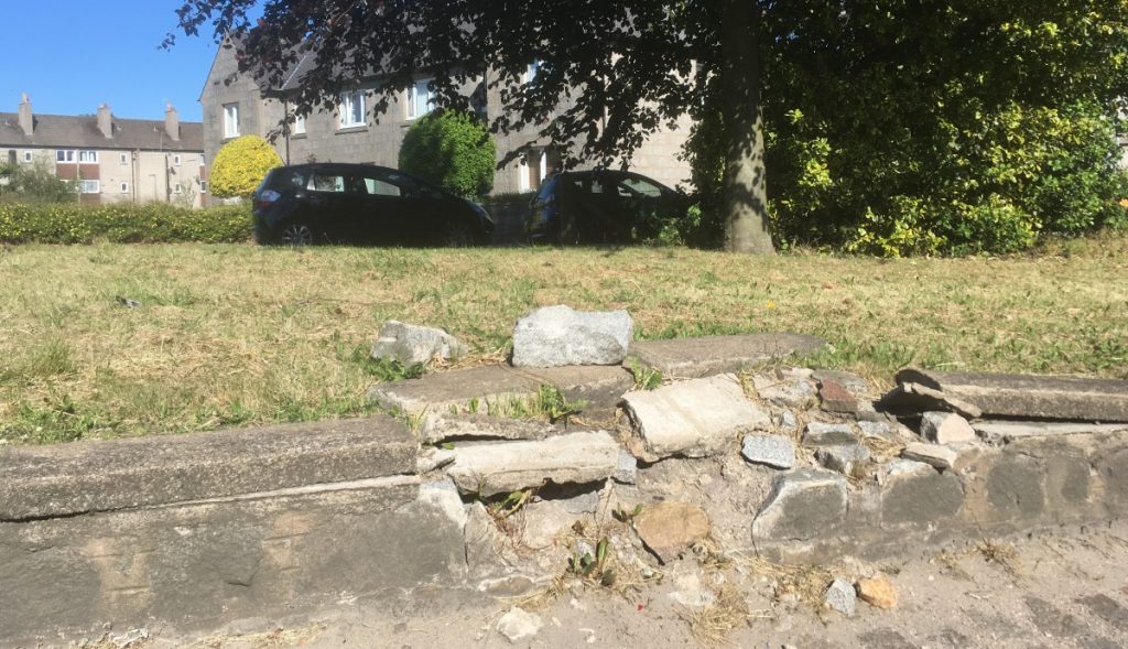 Photo of damaged retaining wall at South Anderson Drive