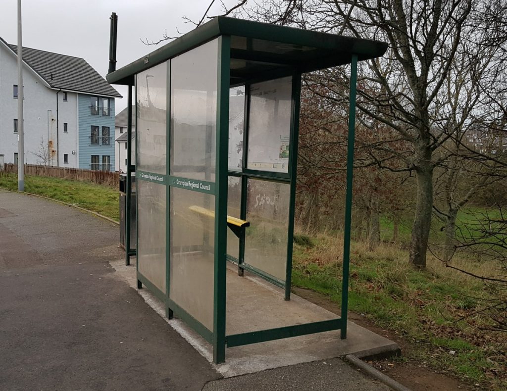 Photo of bus shelter with missing window