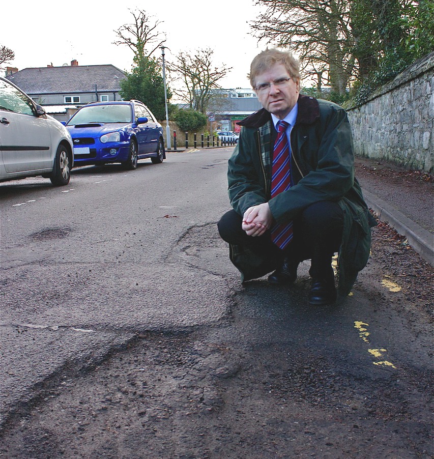 Photo of broken area of road surface on Thorngrove Avenue