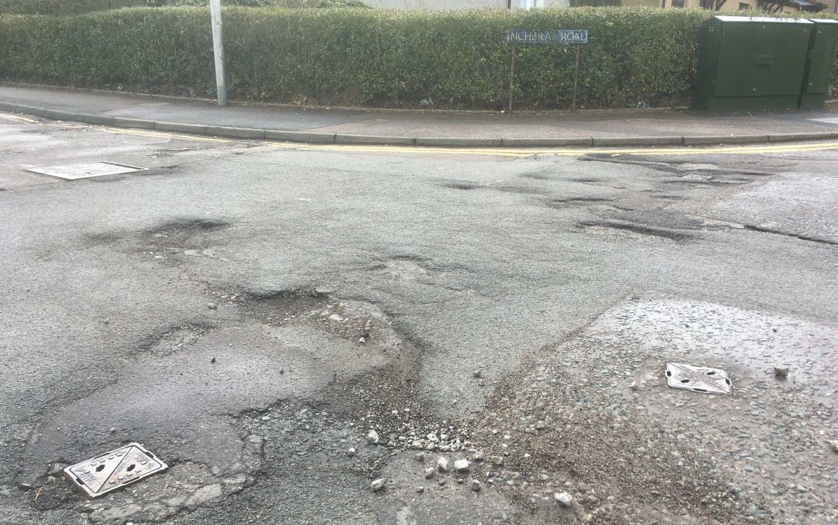 Photo of road surface at juncyion of Inchbrae Drive and Inchbrae Road